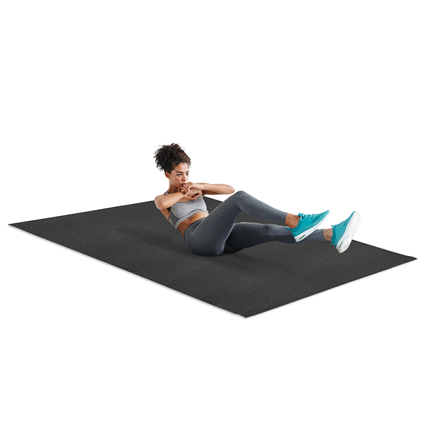 Girl Working Out On Large Exercise Mat
